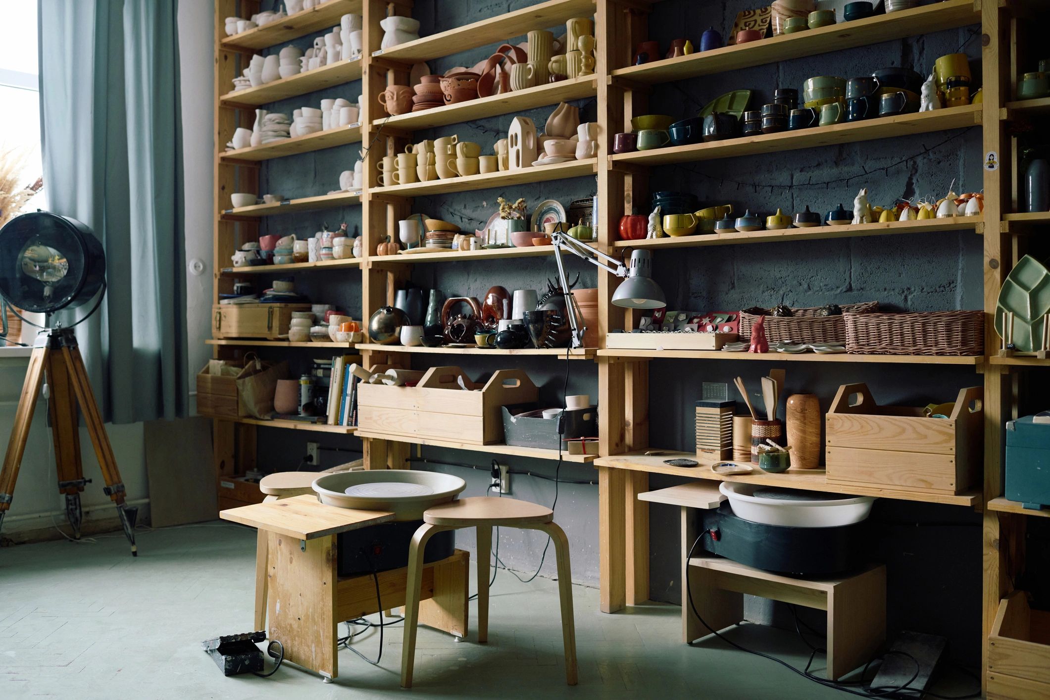 Studio shelves with handcrafted pieces and tools